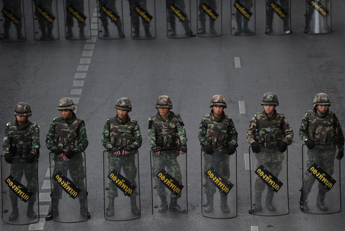 Thai soldiers deployed on a road leading to Victory Monument, the site of recent anti-coup protests on May 30, 2014 in Bangkok. 