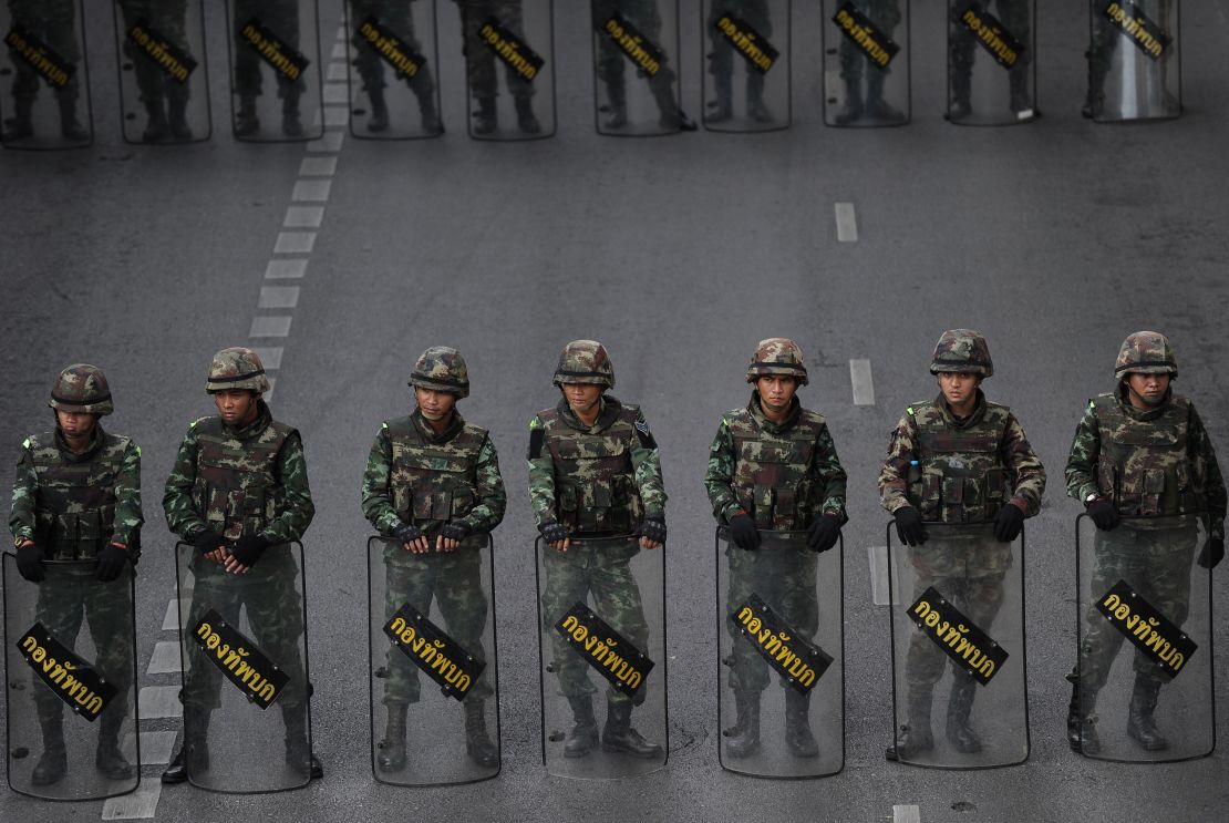 Thai soldiers deployed on a road leading to Victory Monument, the site of recent anti-coup protests on May 30, 2014 in Bangkok.