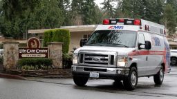 An ambulance leaves the Life Care Center in Kirkland, Wash., Friday, March 6, 2020. The facility is the epicenter of the outbreak of the the COVID-19 coronavirus in Washington state. 