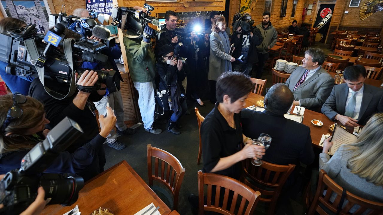 Westchester County Executive George Latimer, center, and New Rochelle Mayor Noam Bramson, right, are surrounded by the press as they eat lunch at Eden Wok Kosher Chinese in New Rochelle, New York, on March 5, 2020.
