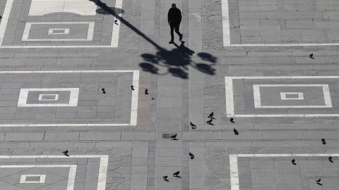 A square in Milan is nearly empty as people observe the restrictions.