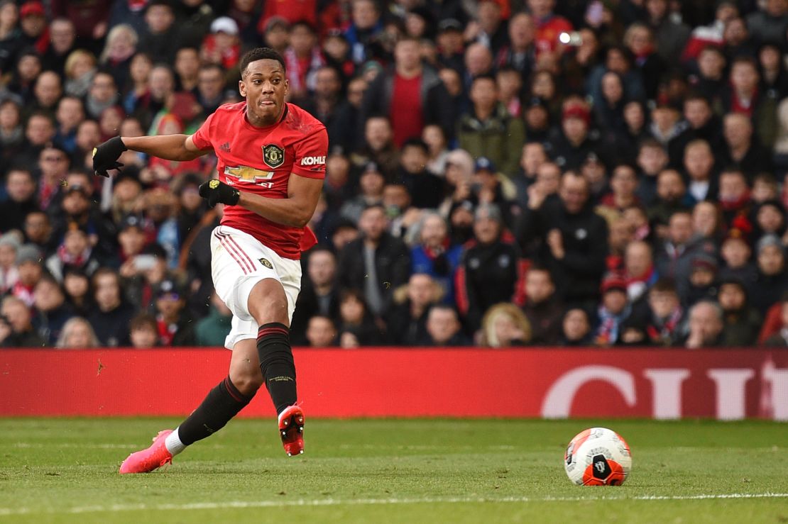 Striker Anthony Martial scores the opening goal for Manchester United.