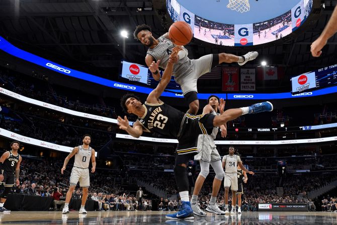Villanova's Jermaine Samuels falls after he was fouled by Georgetown's Jagan Mosely during the second half of the game in Washington on March 7. Villanova won 70-69.