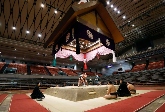 Sumo wrestlers contest a bout at the Spring Grand Sumo Tournament at Edion Arena Osaka on March 8. It was the first time ever that a grand sumo tournament was held in the absence of spectators, due to the <a href="index.php?page=&url=https%3A%2F%2Fwww.cnn.com%2F2020%2F01%2F23%2Fworld%2Fgallery%2Fwuhan-coronavirus-outbreak%2Findex.html" target="_blank">ongoing coronavirus outbreak</a>. 