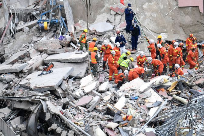 Rescuers search for victims at the site of a <a href="index.php?page=&url=https%3A%2F%2Fwww.cnn.com%2F2020%2F03%2F07%2Fchina%2Fchina-coronavirus-hotel-collapse%2Findex.html" target="_blank">collapsed hotel</a> in Quanzhou, China, on March 8. The hotel was being used as a coronavirus quarantine center.
