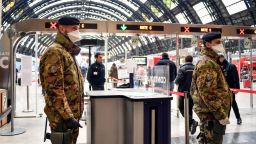 Italian army soldiers patrol the gates of Milan main train station, Italy, Monday, March 9, 2020. Italy took a page from China's playbook Sunday, attempting to lock down 16 million people — more than a quarter of its population — for nearly a month to halt the relentless march of the new coronavirus across Europe. Italian Premier Giuseppe Conte signed a quarantine decree early Sunday for the country's prosperous north. Areas under lockdown include Milan, Italy's financial hub and the main city in Lombardy, and Venice, the main city in the neighboring Veneto region. The extraordinary measures will be in place until April 3. (Claudio Furlan/LaPresse via AP)