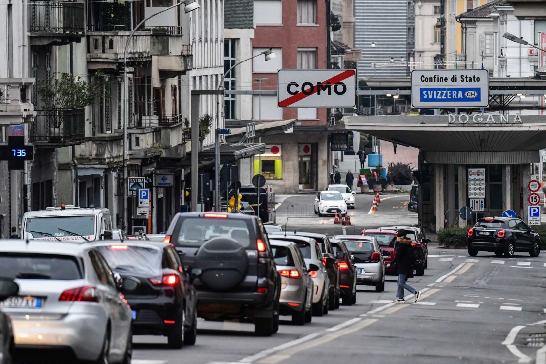 Cars line up to cross the Italy-Switzerland border at the Ponte Chiasso customs post north of Milan, on Monday.