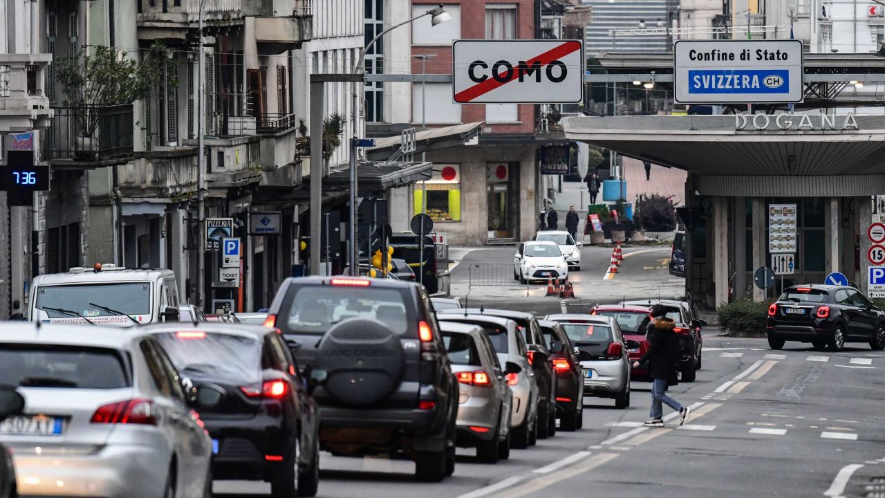 Cars line up to cross the Italy-Switzerland border at the Ponte Chiasso customs post north of Milan, on Monday.