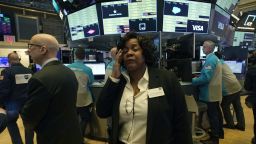 Yvette Arrington, with the New York Stock Exchange reacts as traders on the floor gather before the opening bell on the New York Stock Exchange on March 9, 2020 in New York. - Trading on Wall Street was temporarily halted early March 9, 2020 as US stocks joined a global rout on crashing oil prices and mounting worries over the coronavirus.The suspension was triggered after the S&P 500's losses hit seven percent. Near 1340 GMT, the broad-based index was down more than 200 points at 2,764.21. (Photo by Timothy A. Clary/AFP/Getty Images)