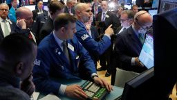Specialist Philip Finale, background center, works with traders on the floor of the New York Stock Exchange, Monday, March 9, 2020. The Dow Jones Industrial Average plummeted 1,500 points, or 6%, following similar drops in Europe after a fight among major crude-producing countries jolted investors already on edge about the widening fallout from the outbreak of the new coronavirus. (AP Photo/Richard Drew)
