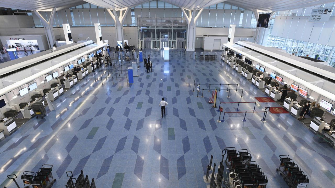Nearly empty airports such as Tokyo's Haneda show how hard air travel has been hit.