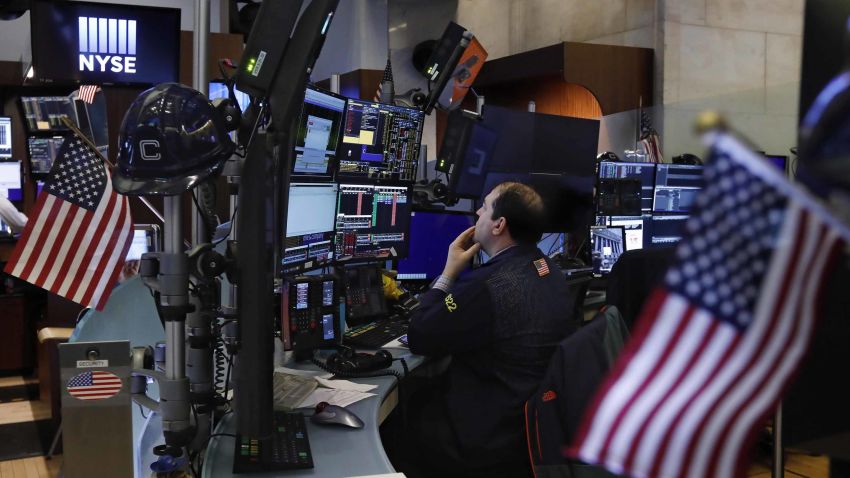 Trader Jonathan Greco prepares for the day's activity on the floor of the New York Stock Exchange, Monday, March 9, 2020. Trading in Wall Street futures has been halted after they fell by more than the daily limit of 5%. (AP Photo/Richard Drew)
