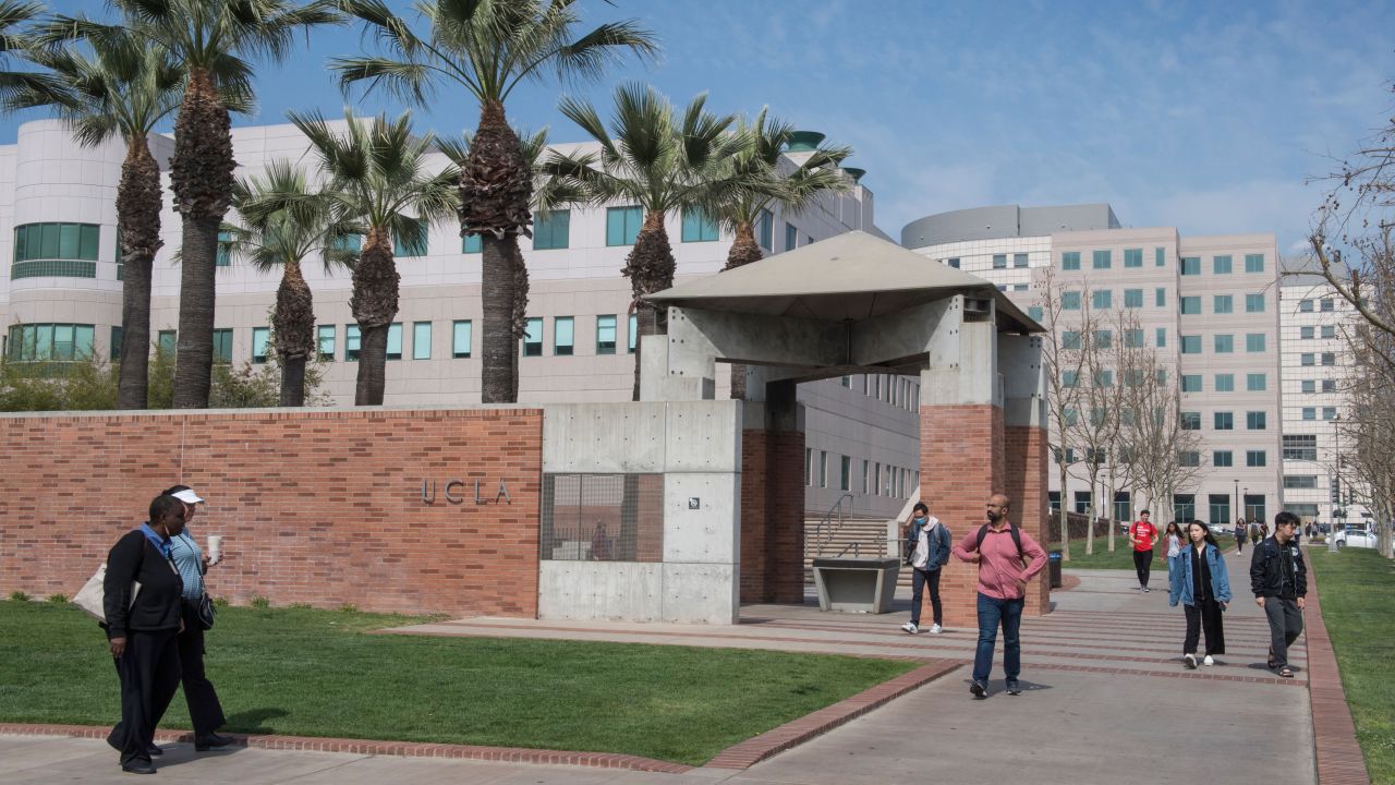 People walk through the campus of the UCLA college in Westwood, California on March 6, 2020. - Three UCLA students are currently being tested for the COVID-19 (coronavirus) by the LA Departement of Public Health, according to the UCLA Chancellor Gene Block. (Photo by Mark RALSTON / AFP) (Photo by MARK RALSTON/AFP via Getty Images)