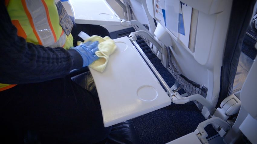 alaska airline plane cleaning tray tables