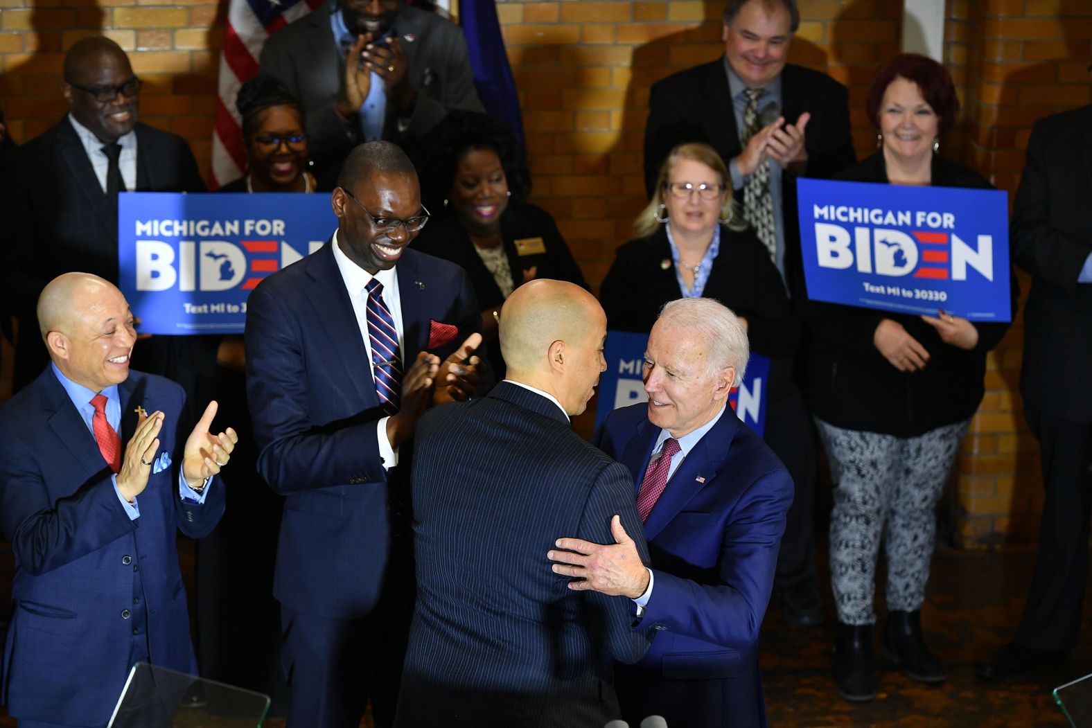 Biden is greeted by US Sen. Cory Booker at a campaign event in Flint, Michigan, on Monday. Booker, a former presidential candidate, <a href="index.php?page=&url=http%3A%2F%2Fwww.cnn.com%2F2020%2F03%2F09%2Fpolitics%2Fcory-booker-endorses-joe-biden%2Findex.html" target="_blank">endorsed Biden</a> during the event. Biden has also scored endorsements from several other former candidates, including US Sen. Amy Klobuchar, US Sen. Kamala Harris, former New York Mayor Michael Bloomberg and former South Bend, Indiana, Mayor Pete Buttigieg.