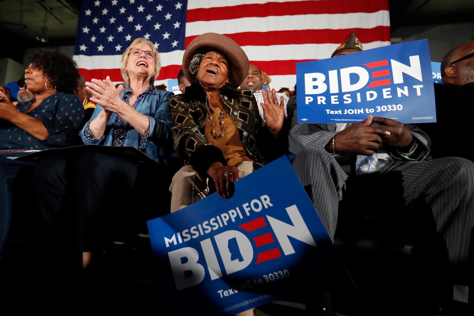 People cheer for Biden before he spoke in Touglaoo, Mississippi, on Sunday.
