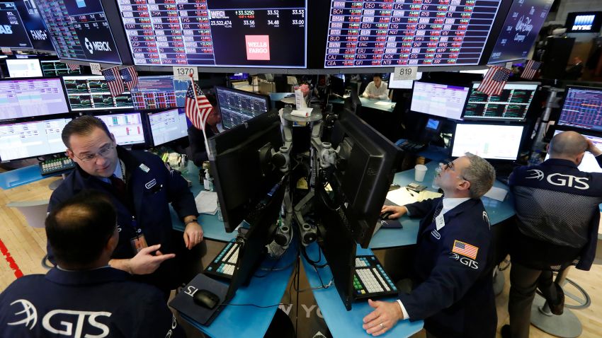 Specialists Anthony Matesic, left, and Anthony Rinaldi, second from right, work on the floor of the New York Stock Exchange, Monday, March 9, 2020. Stocks went into a steep slide Monday on Wall Street as coronavirus fears and a crash in oil prices spread alarm through the market, triggering the first automatic trading halt in over two decades. (AP Photo/Richard Drew)