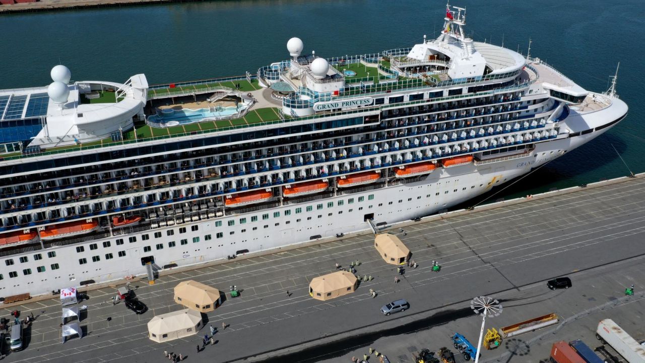 Workers set up tents on the dock next to the Grand Princess cruise ship.