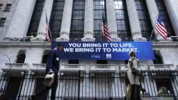 NEW YORK, NEW YORK - MARCH 09: People walk by the New York Stock Exchange (NYSE) on March 09, 2020 in New York City. As global fears from the coronavirus continue to escalate, trading was halted for 15 minutes after the opening bell as stocks fell 7 percent. (Photo by Spencer Platt/Getty Images)
