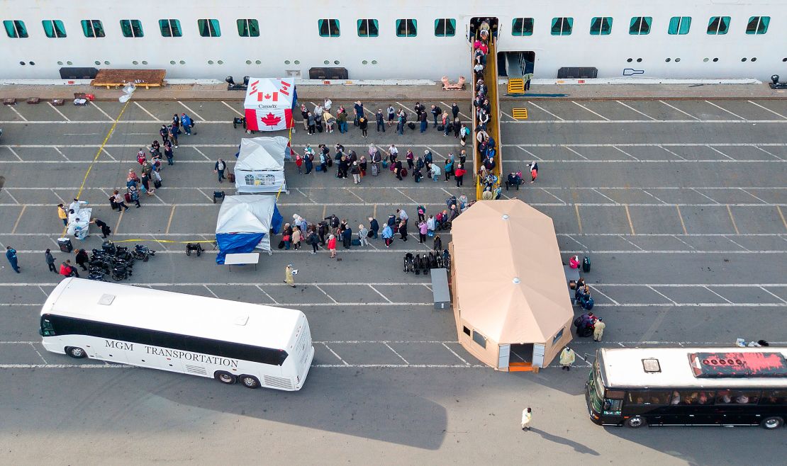 Canadians disembark from the Grand Princess cruise ship at the Port of Oakland in California.