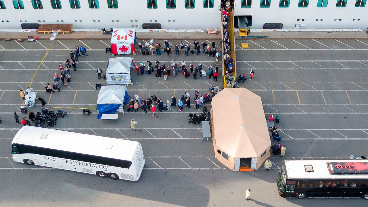 Canadians disembark from the Grand Princess cruise ship at the Port of Oakland in California.