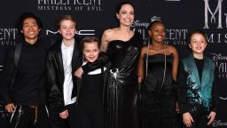 US actress Angelina Jolie (C) and children (fromL) Pax Thien Jolie-Pitt, Shiloh Nouvel Jolie-Pitt, Vivienne Marcheline Jolie-Pitt, Zahara Marley Jolie-Pitt, and Knox Leon Jolie-Pitt arrive for the world premiere of Disney's "Maleficent: Mistress of Evil" at the El Capitan Theatre in Hollywood on September 30, 2019. (Photo by VALERIE MACON / AFP) / The erroneous mention appearing in the metadata of this photo by VALERIE MACON has been modified in AFP systems in the following manner: [Pax Thien Jolie-Pitt] instead of [Maddox Chivan Jolie-Pitt]. Please immediately remove the erroneous mention from all your online services and delete it from your servers. If you have been authorized by AFP to distribute it to third parties, please ensure that the same actions are carried out by them. Failure to promptly comply with these instructions will entail liability on your part for any continued or post notification usage. Therefore we thank you very much for all your attention and prompt action. We are sorry for the inconvenience this notification may cause and remain at your disposal for any further information you may require. (Photo by VALERIE MACON/AFP via Getty Images)