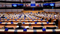 Members of the EU Parliament arrive and sit in an empty hemicycle at the beginning of the plenary session which is reduced to a single day due to the spread of the COVID-19 illness, in Brussels, on March 10, 2020. - All European Union States are hit by the novel coronavirus. (Photo by Kenzo TRIBOUILLARD / AFP) (Photo by KENZO TRIBOUILLARD/AFP via Getty Images)