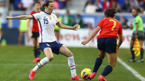 Marta Corredera goes past the USWNT's Megan Rapinoe during the She Believes Cup clash.
