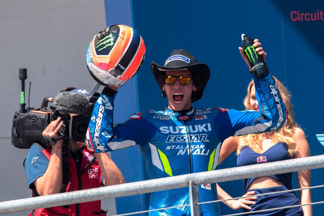 Alex Rins celebrates victory on the podium at the end of the MotoGp Red Bull U.S. Grand Prix of The Americas.