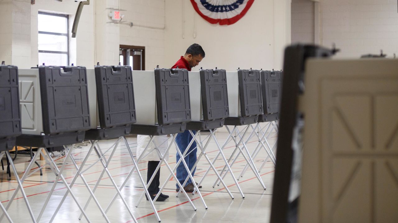 Two people vote at the Fitzgerald Recreation Center on March 10, 2020 in Warren, Michigan. Michigan is one of six states voting in the Democratic presidential primary today. 