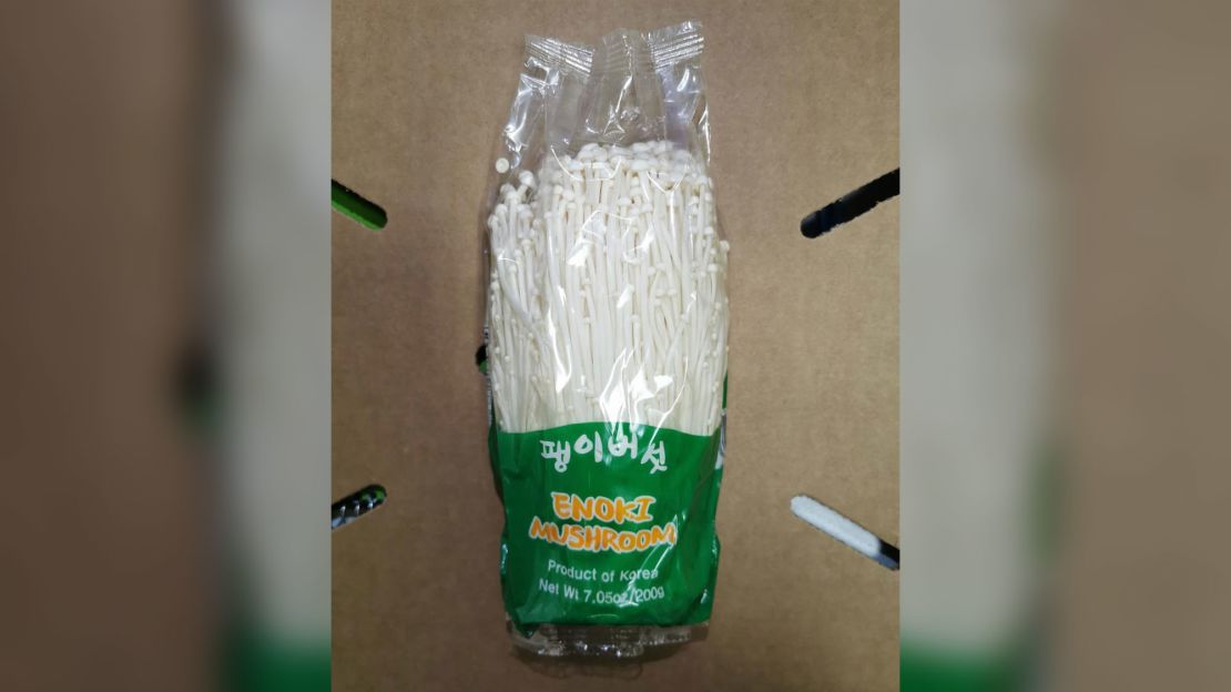 The recalled mushrooms were sold in clear plastic packages with a green label.