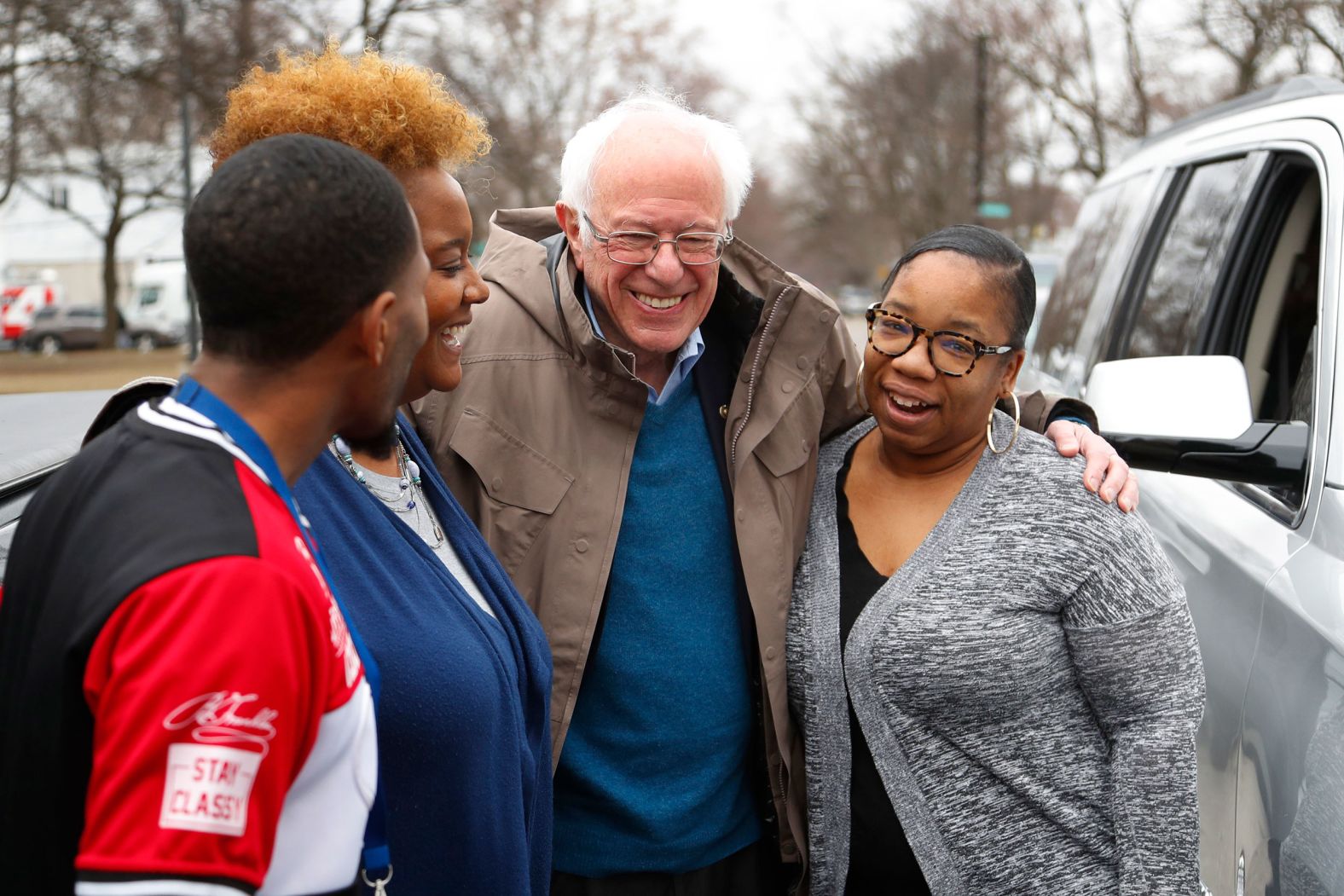 Sanders visits, from left, custodian Davonta Bynes, principal DaRhonda Evans-Stewart and social worker Kim Little outside a polling location at Detroit's Warren E. Bow Elementary School.