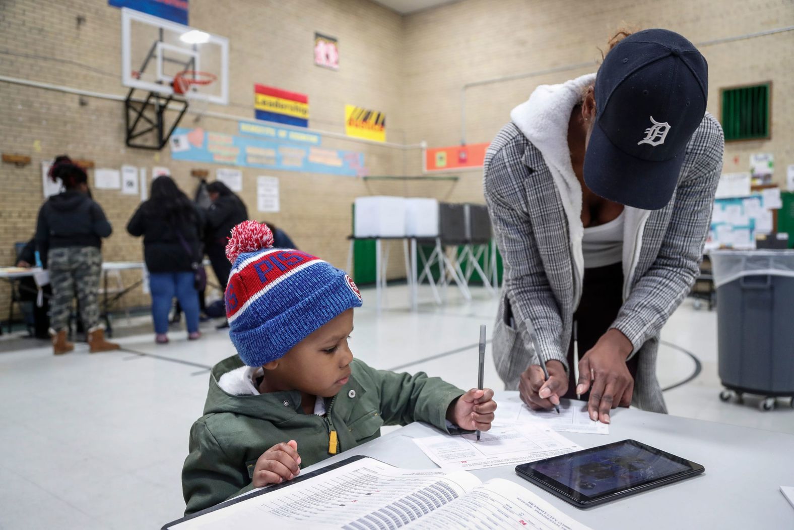 Carla Strickland and her son, Xavier Rogers, get ready to vote at a polling station in Detroit.