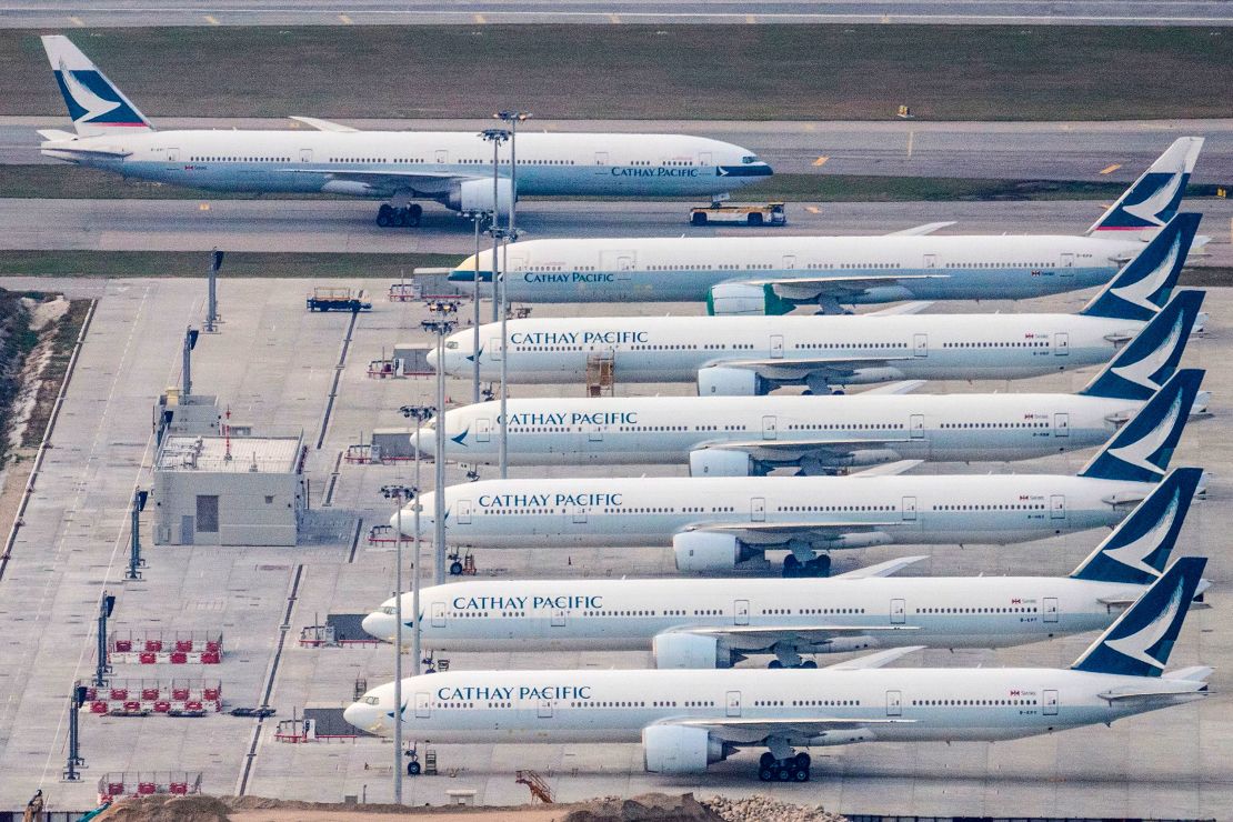 Cathay Pacific planes are seen parked on the tarmac in Hong Kong.