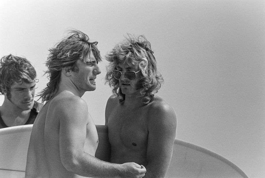 Divine's images feature some of the era's top surfers, such as Allen Sarlo (pictured here with Glen Kennedy and John Thornton in Malibu, California).