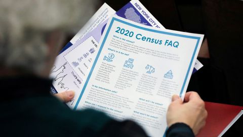 A person holds census information at an event where U.S. Rep. Alexandria Ocasio-Cortez (D-NY) spoke at a Census Town Hall at the Louis Armstrong Middle School in Queens, New York City, U.S., February 22, 2020. 