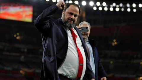Evangelos Marinakis celebrates after Olympiacos' Europa league victory over Arsenal