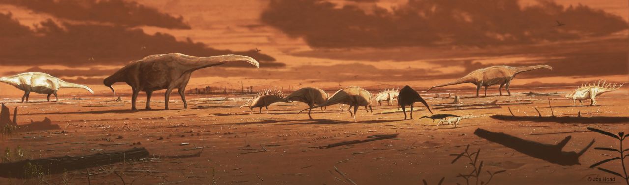 This is an artist's impression of dinosaurs on prehistoric mudflat in Scotland, based on varied dinosaur footprints recovered on the Isle of Skye. 