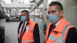 Employees wear protective masks as a preventive measure against the spread of coronavirus COVID-19, at the Mexico City International Airport, on March 3, 2020. - The spread of the coronavirus could force weak airlines to merge with competitors, the head of Air France-KLM and the A4E association of European airlines said Tuesday. (Photo by Pedro PARDO / AFP) (Photo by PEDRO PARDO/AFP via Getty Images)