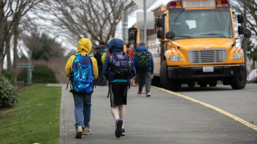 SEATTLE, WASHINGTON - MARCH 11: Students leave the Thurgood Marshal Elementary school after the Seattle Public School system was abruptly closed due to coronavirus fears on March 11, 2020 in Seattle, Washington. Schools will be closed for a minimum of two weeks. The system is the largest public school district in Washington State. (Photo by John Moore/Getty Images)