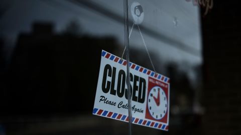 A sign in the containment zone in New Rochelle, New York, on Wednesday tells customers the business is closed.