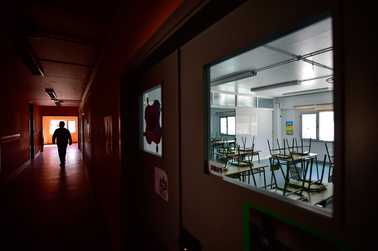 A teacher walks in an empty public school in Labastida, Spain, on March 11.