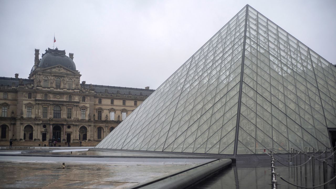 A view of the Louvre museum, in Paris, France, Sunday, March 1, 2020. The spreading coronavirus epidemic shut down France's Louvre Museum on Sunday, with workers who guard its trove of artworks fearful of being contaminated by the museum's flow of visitors from around the world. (AP Photo/Rafael Yaghobzadeh)