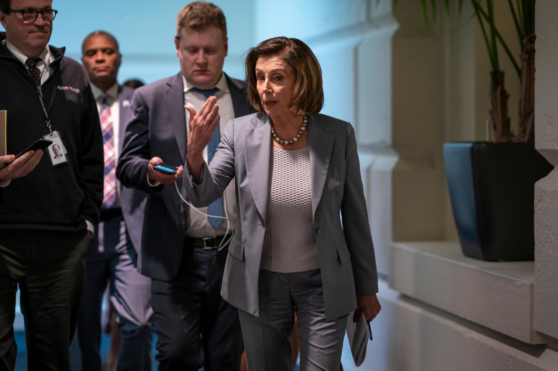 House Speaker Nancy Pelosi walks to a meeting with her Democratic caucus on Capitol Hill on Wednesday.