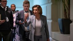 Speaker of the House Nancy Pelosi, D-Calif., walks to a meeting with her Democratic caucus as House moves toward passage of a coronavirus aid package on Capitol Hill in Washington, Wednesday, March 11, 2020. 