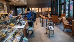 SEATTLE, WASHINGTON - MARCH 10: A Starbucks coffee shop sits mostly empty at Amazon headquarters on March 10, 2020 in downtown Seattle, Washington.