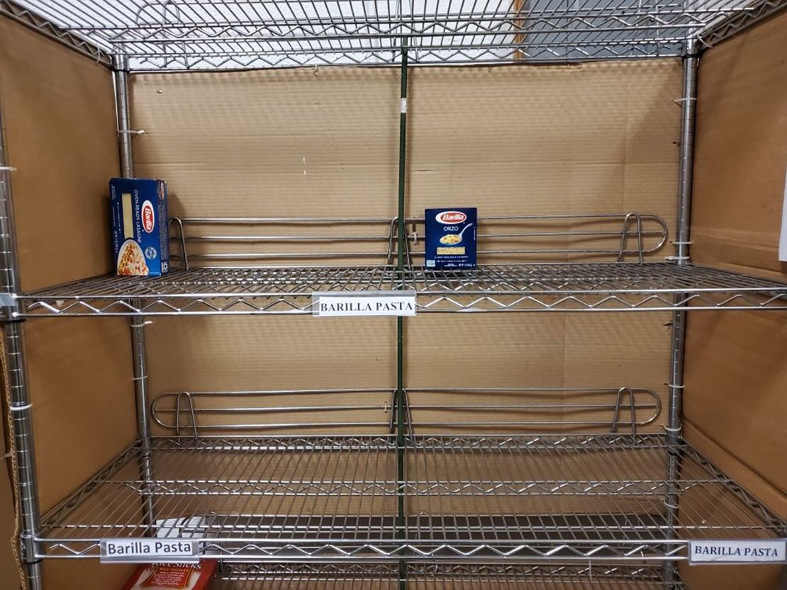 Lone boxes of pasta sit on the shelves at the Food Bank of Lower Fairfield County in Connecticut.