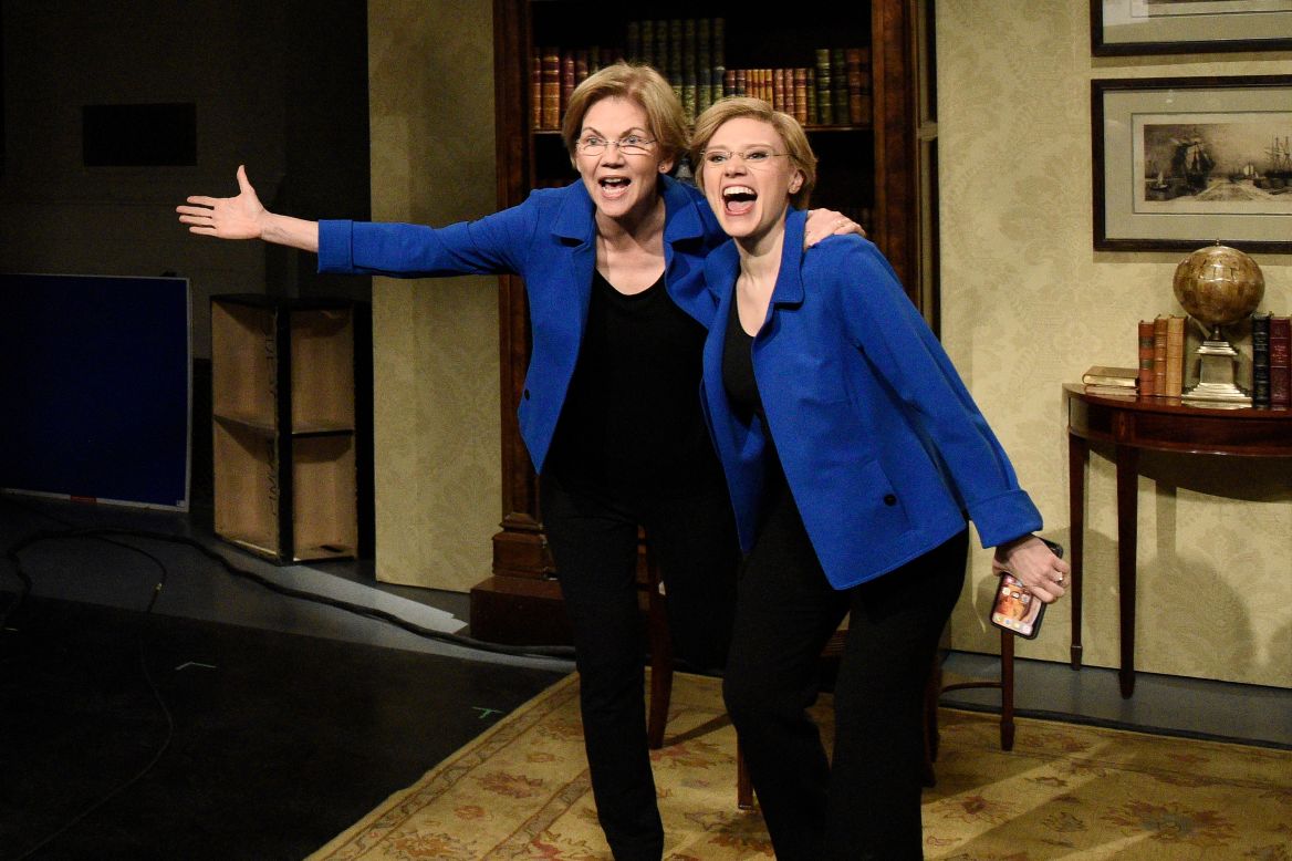 US Sen. Elizabeth Warren, left, <a href="https://www.cnn.com/2020/03/08/media/snl-fox-news-coronavirus/index.html" target="_blank">appears on "Saturday Night Live"</a> with actress Kate McKinnon, playing Warren, on March 7. "I wanted to put on my favorite outfit to thank you for all you've done in your lifetime," McKinnon said. "I'm not dead," Warren responded. "I'm just in the Senate." The two then said the show's famous catchphrase, "Live ... from New York! It's Saturday night!"