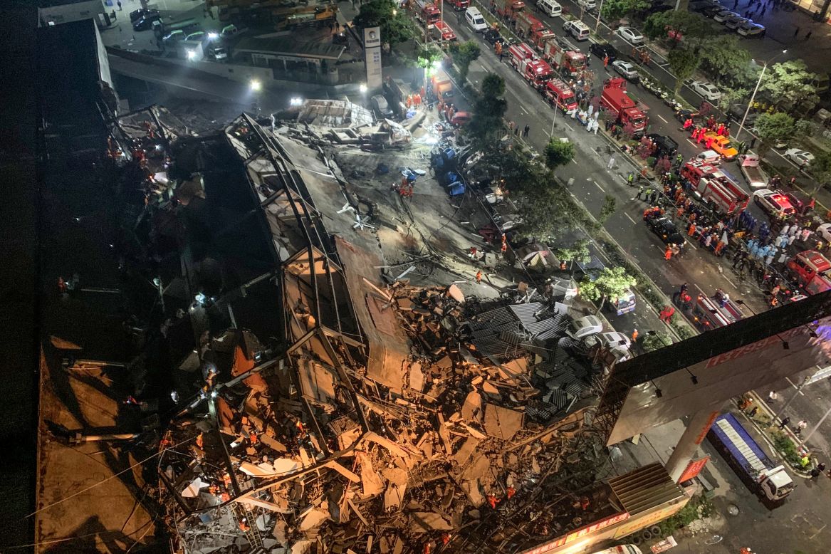 Rescuers search for people at the site of a <a href="https://www.cnn.com/2020/03/07/china/china-coronavirus-hotel-collapse/index.html" target="_blank">collapsed hotel</a> in Quanzhou, China, on Sunday, March 8. The hotel was being used as a coronavirus quarantine center.