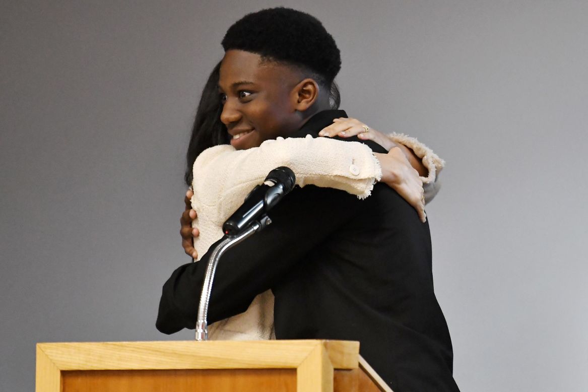 Teenager Aker Okoye hugs Meghan, the Duchess of Sussex, <a href="https://www.cnn.com/2020/03/09/uk/student-letter-to-prince-harry-intl-scli-gbr/index.html" target="_blank">during her surprise visit</a> to the Robert Clack School in London on Friday, March 6.